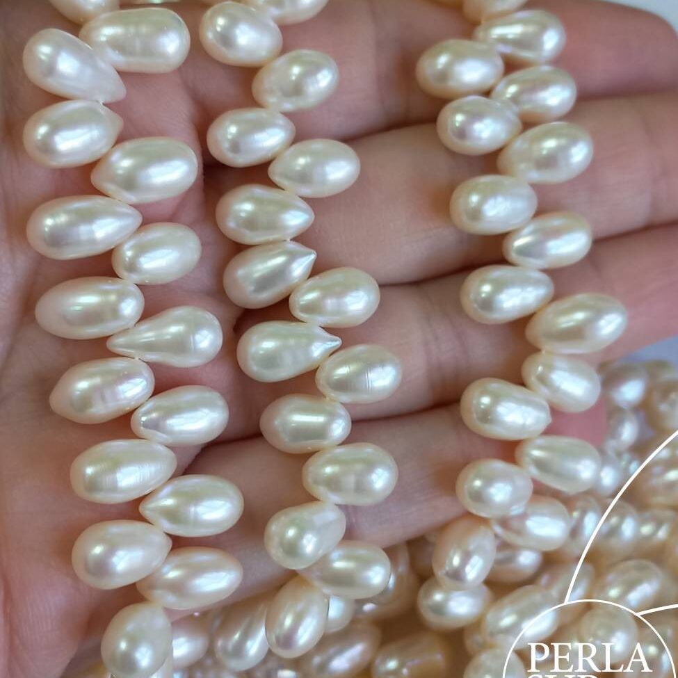 Hilo Perla Oval Cruzada 7x10mm Blanca