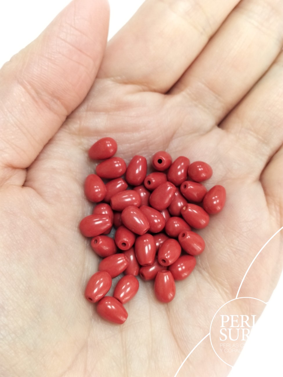 Perilla 5x7mm 1/2t coral sintético (rojo)